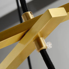 Close-up of brass fixture and black cord detail of YH Lamps modern chandelier pendant