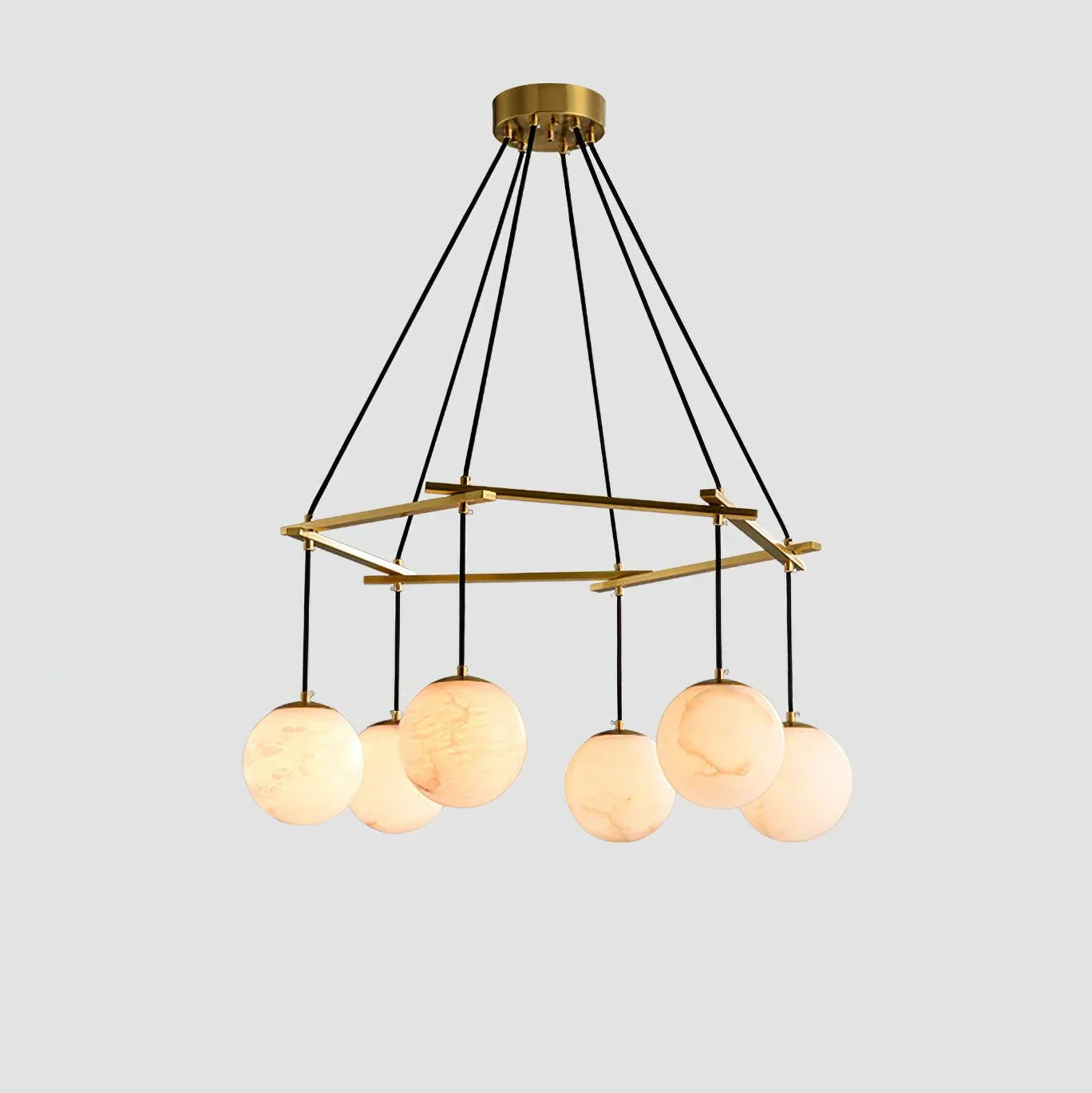 Modern chandelier with six alabaster globe lamps hanging from a brass hexagonal frame