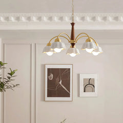 Swedish modern chandelier with six white scalloped shades, brass arms, and walnut wood accent in elegant room