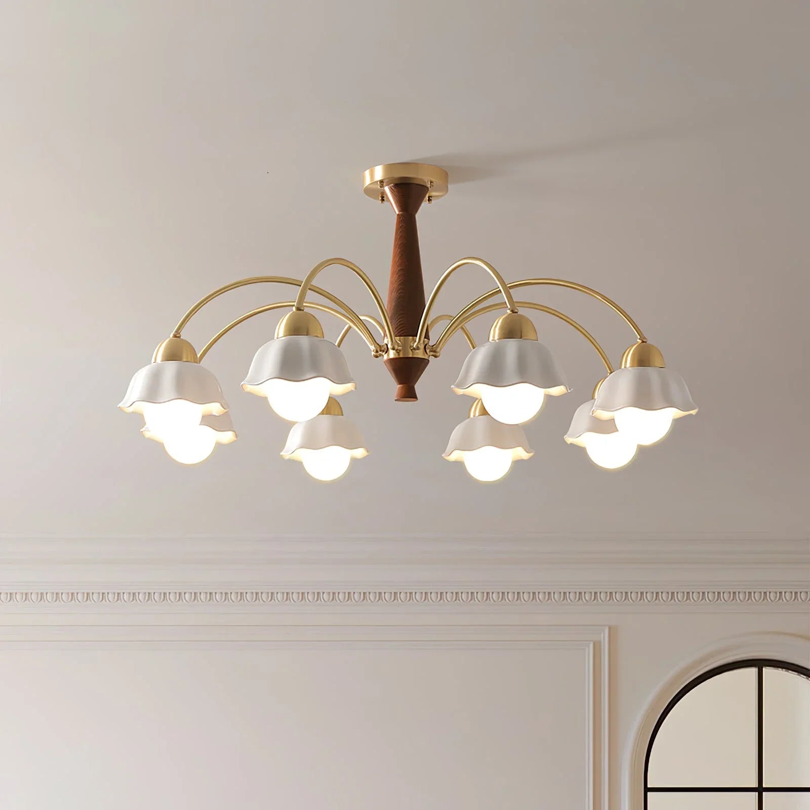 Modern 8-light brass chandelier with walnut wood accents and frosted glass tulip shades on ceiling