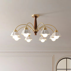 Modern 8-light brass chandelier with walnut wood accents and frosted glass tulip shades on ceiling
