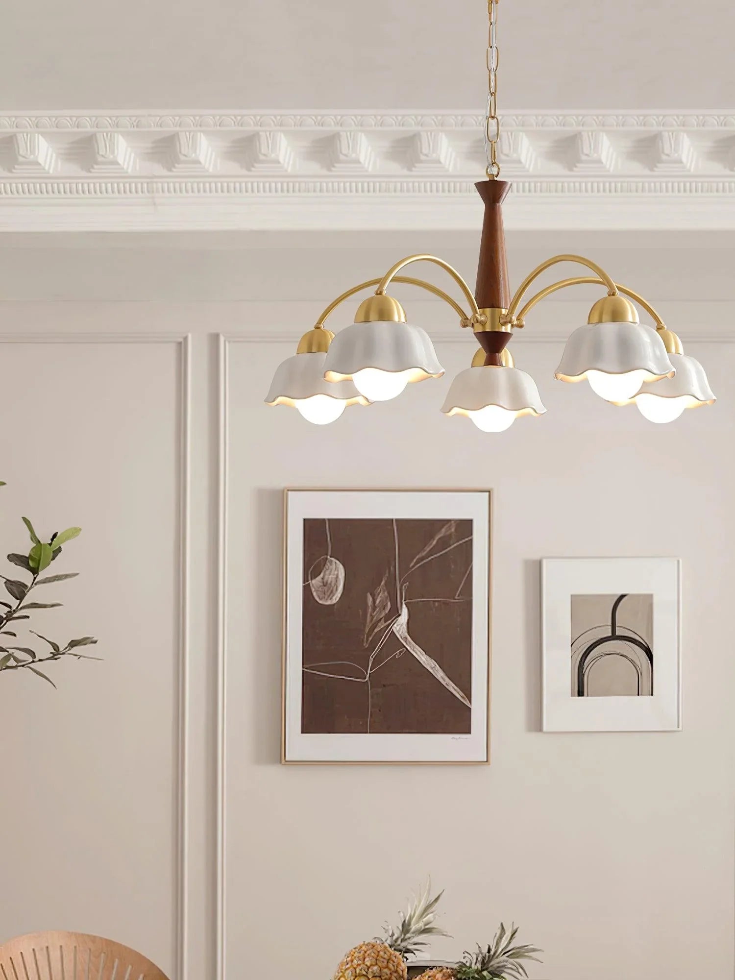 Modern brass and walnut wood chandelier with six white scalloped shades in elegant living room