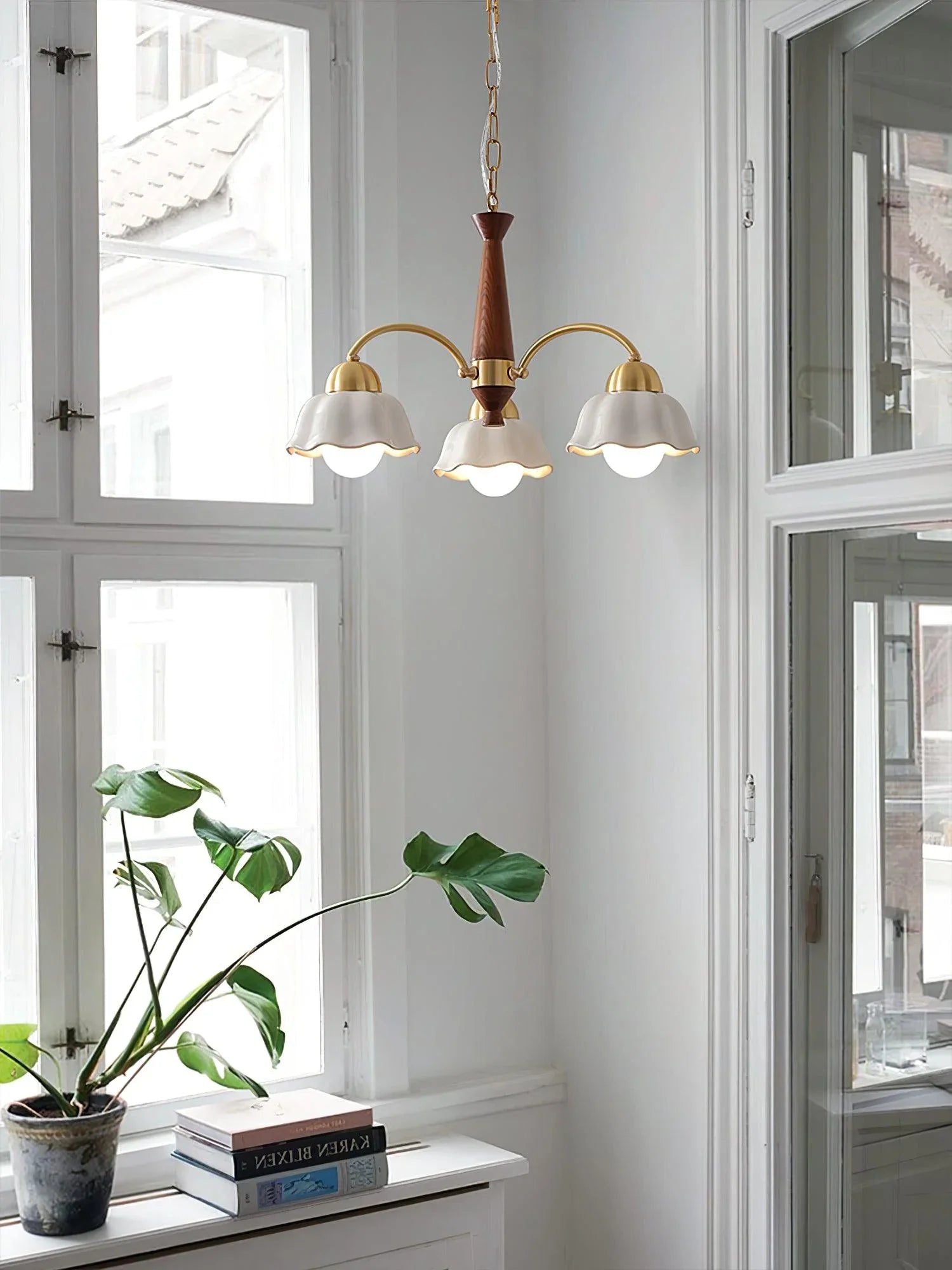 Modern 3-head brass and walnut wood pendant chandelier with white flower-shaped shades in Scandinavian style
