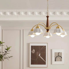 Modern 3-head brass and walnut wood pendant chandelier with white scalloped shades in elegant living room
