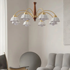 Modern Swedish chandelier with brass arms, walnut wood center, and white flower-shaped glass shades