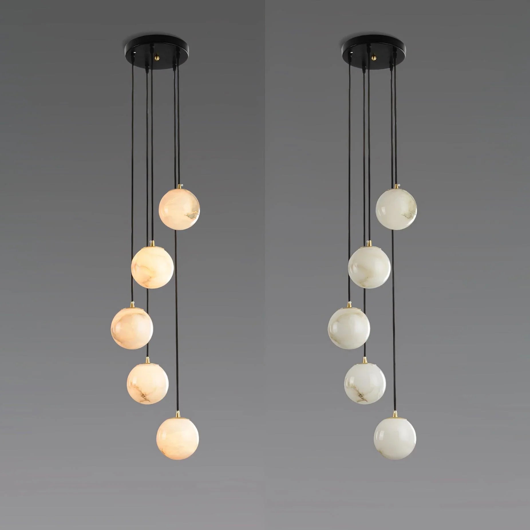 Modern pendant lamp with five alabaster glass globe lights hanging from black round canopy ceiling fixture