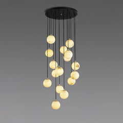 Modern cluster chandelier with 17 alabaster ball pendants hanging from a round black canopy