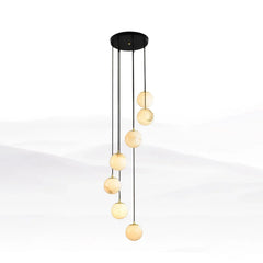 Modern chandelier with seven alabaster globe pendant lights hanging from a round black canopy