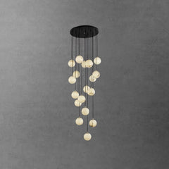 Modern cluster chandelier with round alabaster ball pendants hanging from a black round canopy