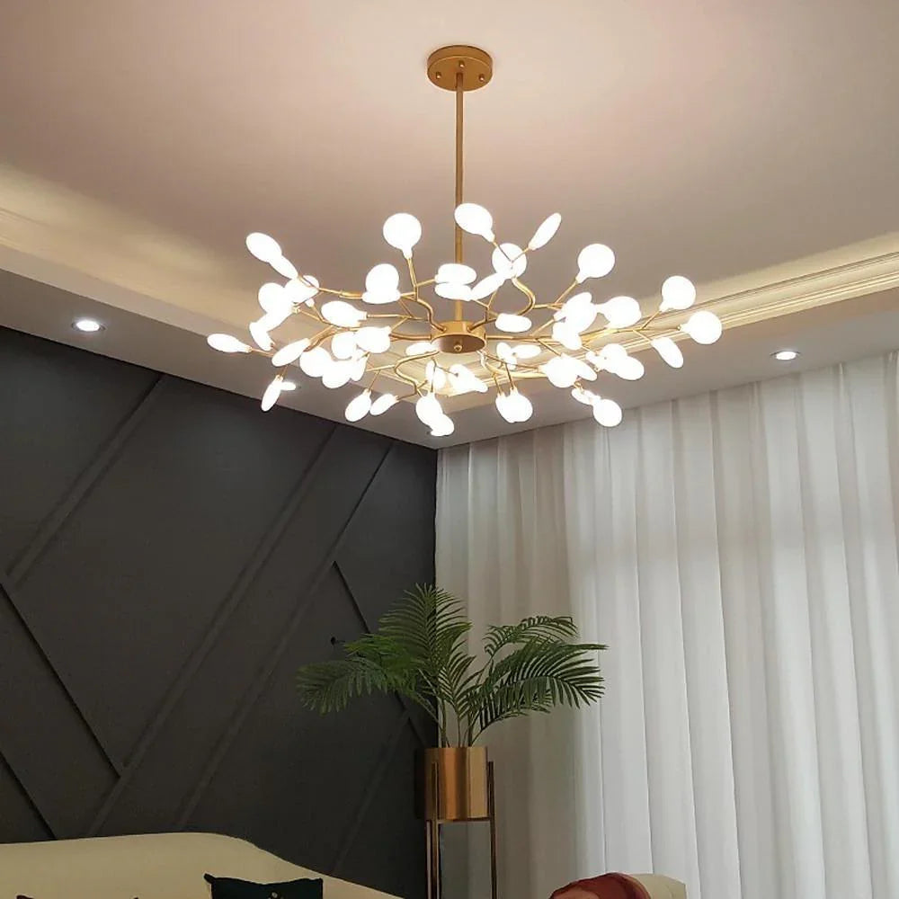 Modern gold ceiling chandelier with multiple white LED lights in a stylish living room with dark wall and white curtains