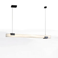 Modern linear black and white Cary alabaster pendant lamp with warm light, suspended by two cables