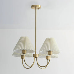 Modern brass chandelier with four pleated white shades by YH Lamps
