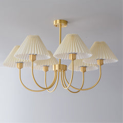 Modern brass chandelier with four pleated white shades from YH Lamps, elegant ceiling lighting