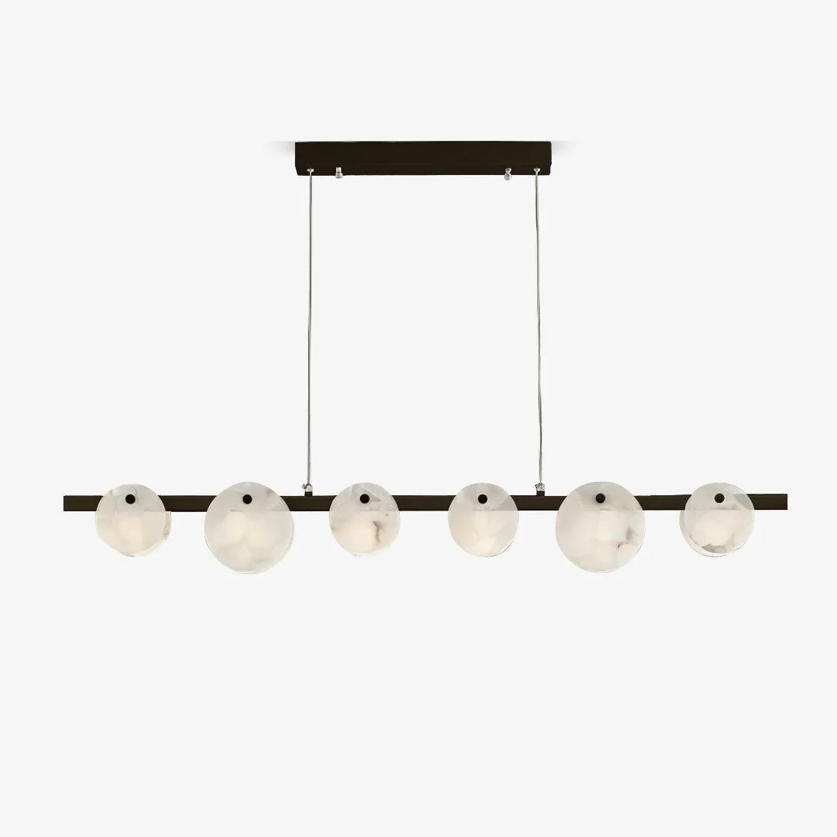 Modern linear chandelier with six round alabaster glass shades and brass finish, suspended by two cables