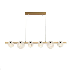 Modern chandelier with six white marble glass shades and brass horizontal bar suspension