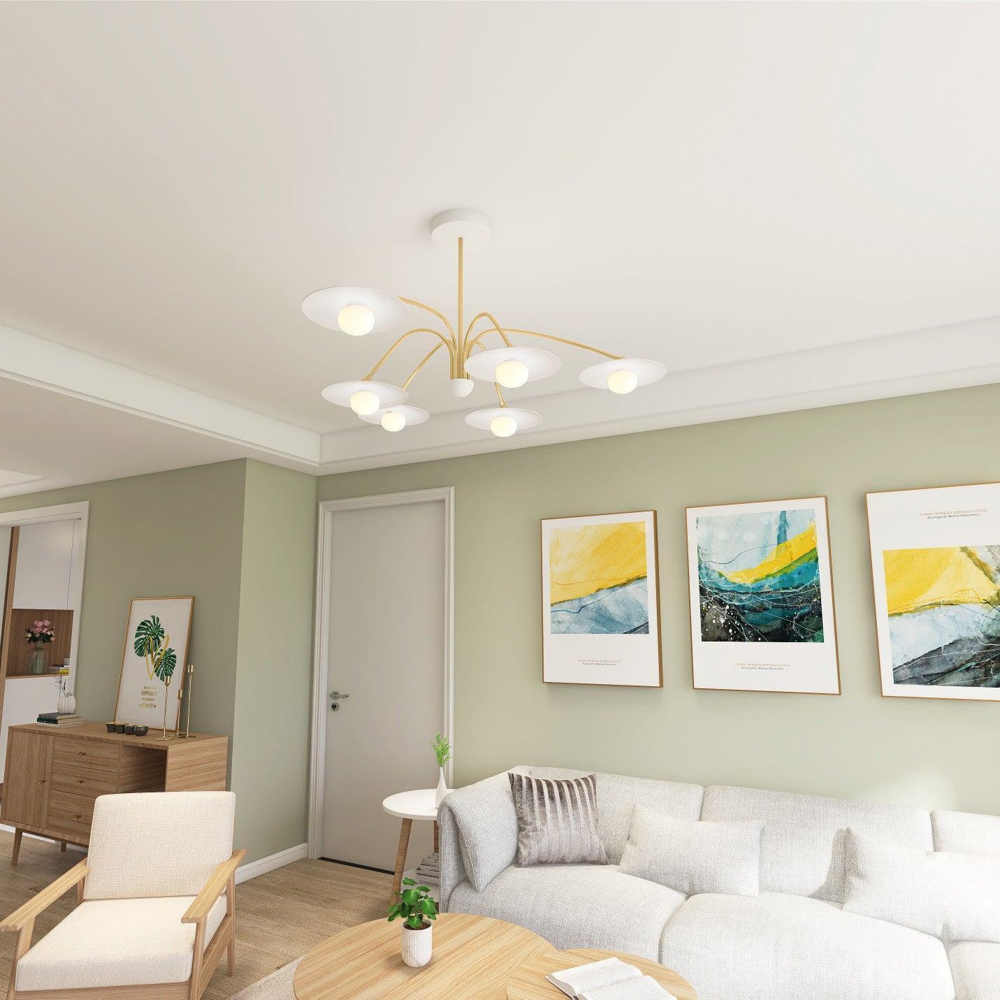 Modern living room with six-head gold and white champignon chandelier, beige sofa, armchair, and abstract art