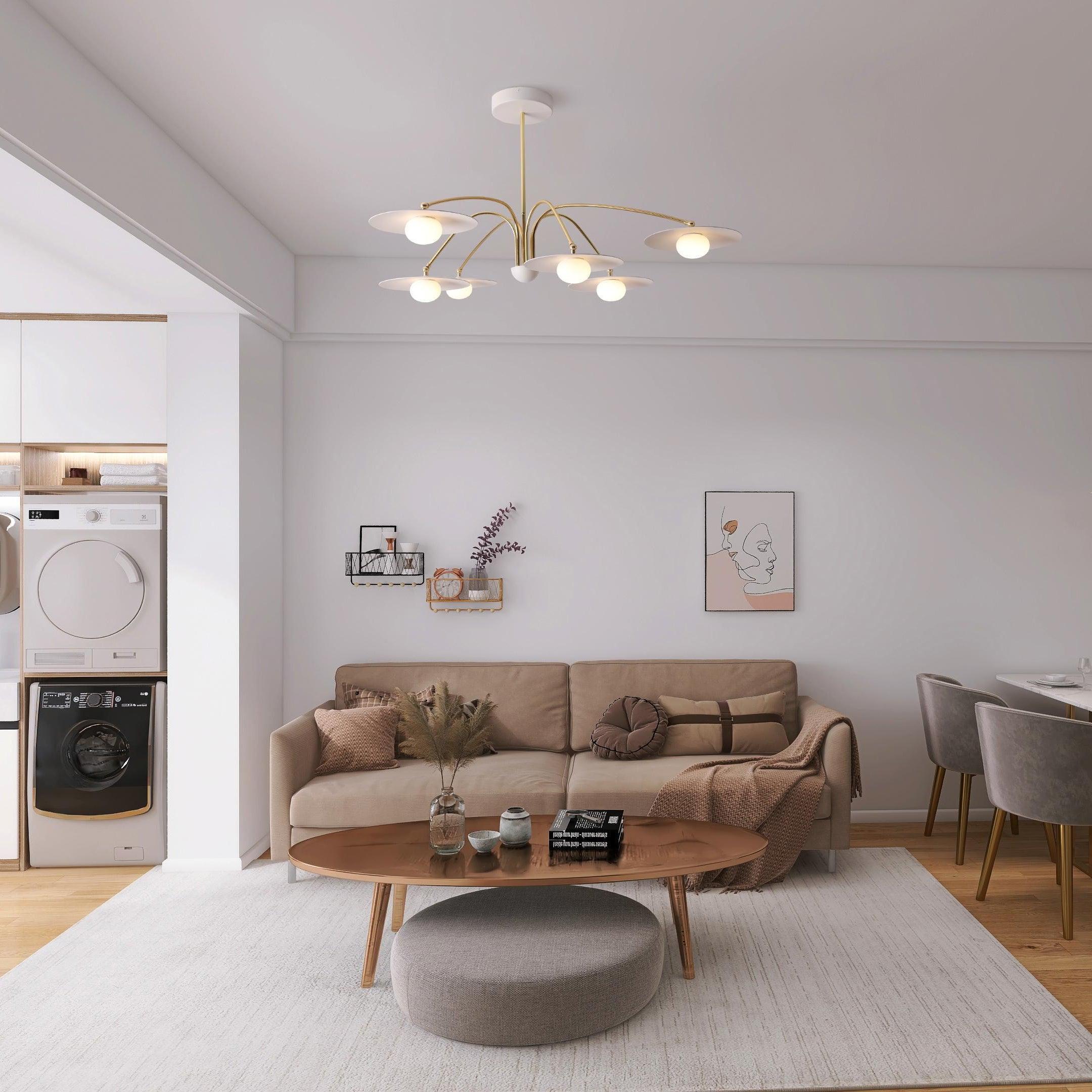 Modern living room with beige sofa, gold and white 6-head chandelier, wooden coffee table, and minimal wall art