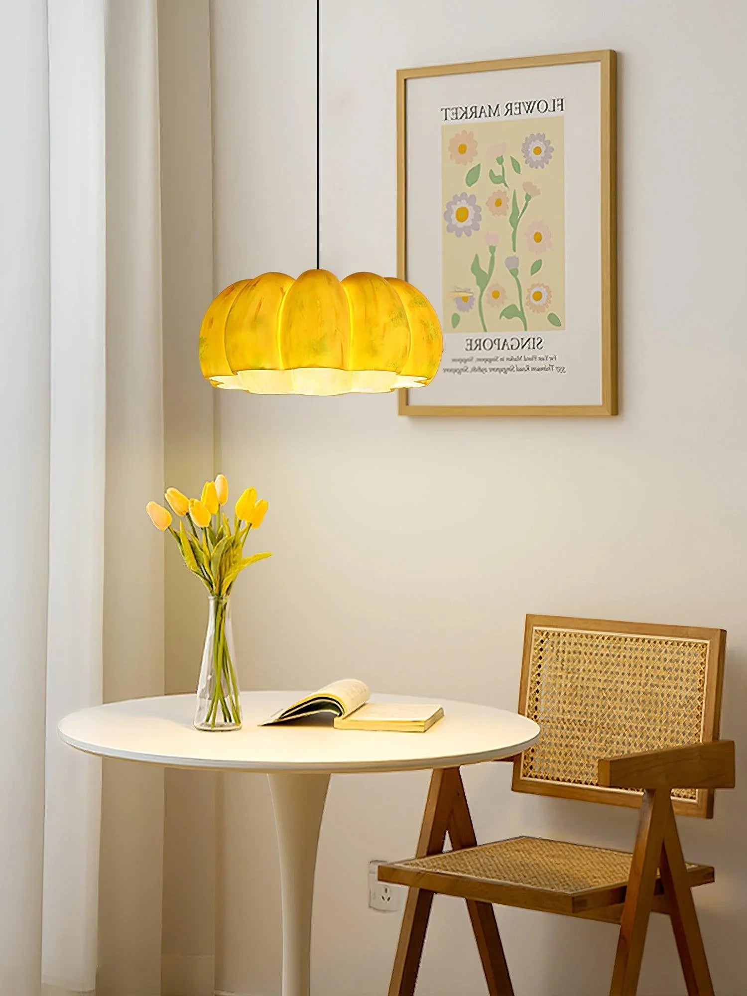 Modern yellow pumpkin pendant chandelier over round table with flowers, YH Lamps home lighting