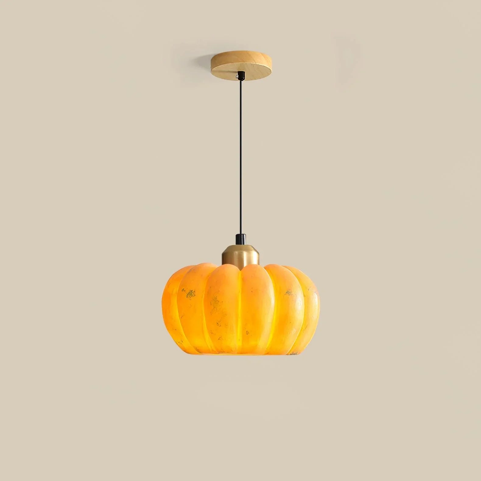 Modern yellow pumpkin-shaped pendant lamp with brass accent from YH Lamps on beige background