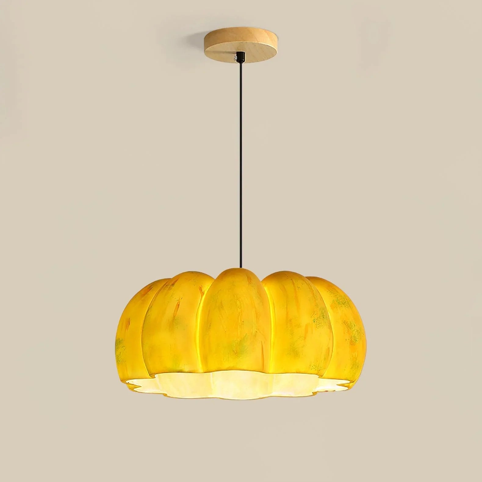 Yellow pumpkin-shaped pendant lamp chandelier from YH Lamps on a neutral background