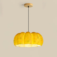 Yellow pumpkin-shaped pendant lamp chandelier from YH Lamps on a neutral background