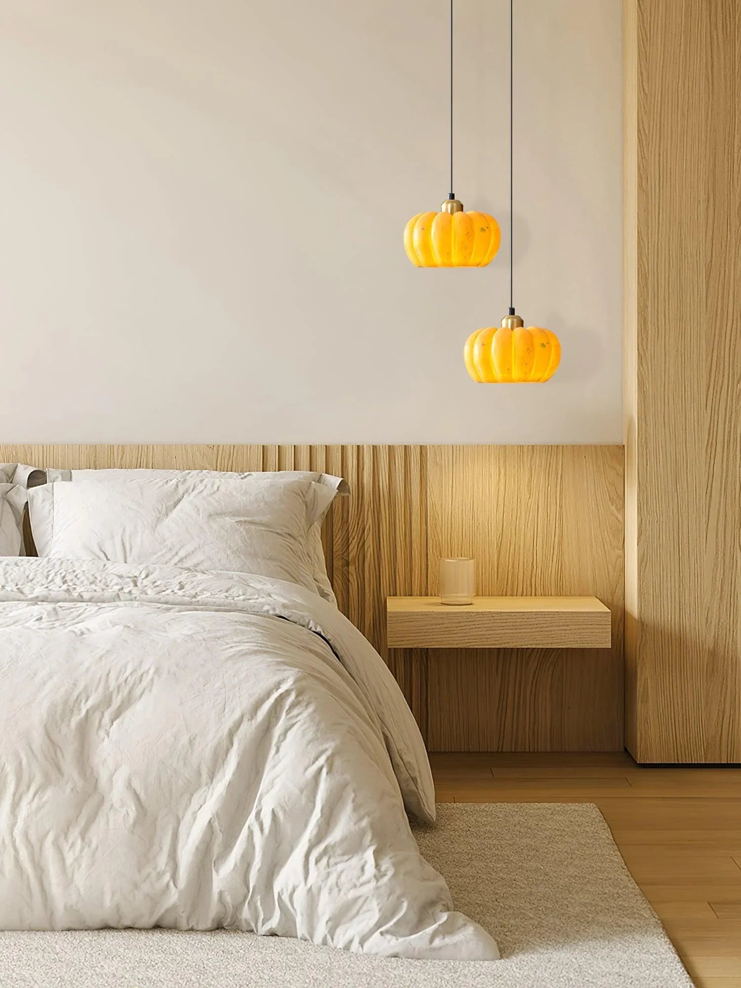 Yellow pumpkin pendant lights above modern wood nightstand in cozy bedroom, YH Lamps style
