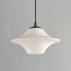 Modern alabaster pendant light with black metal fixture, suspended against gray background