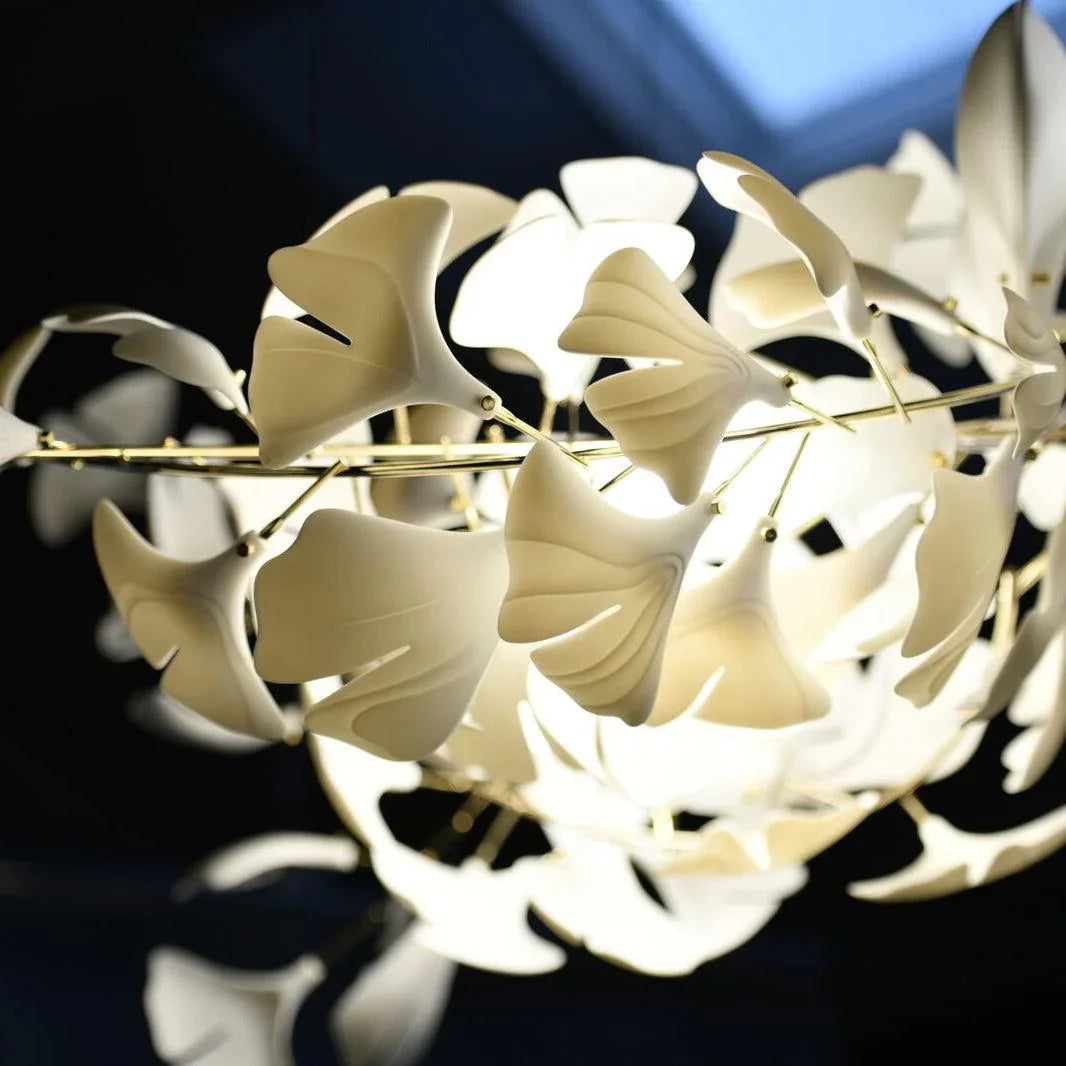 Modern ginkgo chandelier pendant lamp with white leaf-shaped shades and gold frame by YH Lamps