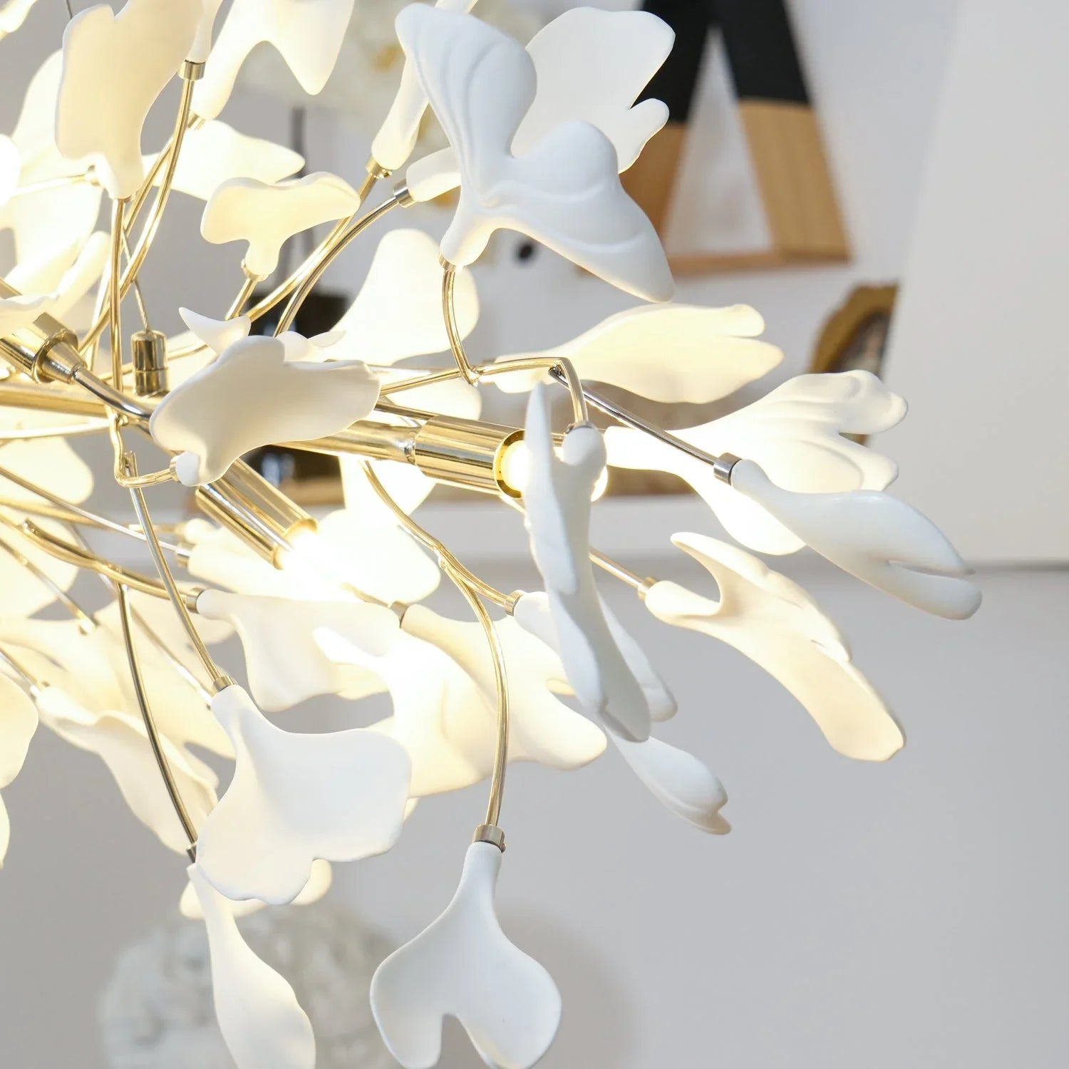 Modern gold and white ginkgo leaf chandelier pendant lamp with elegant sculptural design