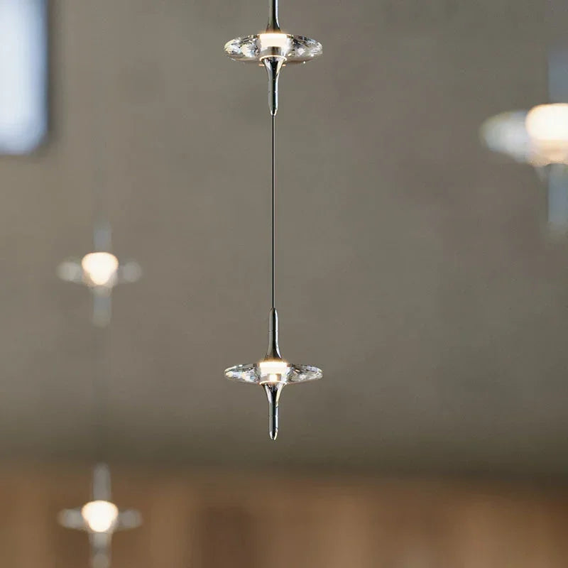 Modern crystal pendant lamp chandelier by YH Lamps, suspended in a minimalist interior.