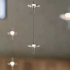 Modern crystal pendant lamp chandelier by YH Lamps, suspended in a minimalist interior.