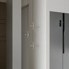 Modern crystal pendant lamps by YH Lamps hanging in a minimalist kitchen interior