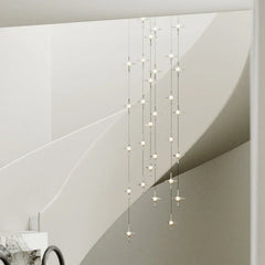 Modern crystal pendant chandelier with multiple lights in a stylish staircase area at YH Lamps