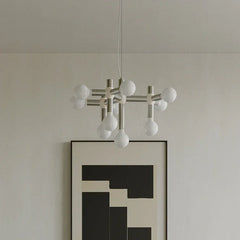 Modern silver 10-head space-age chandelier pendant lamp by YH Lamps in minimalist room