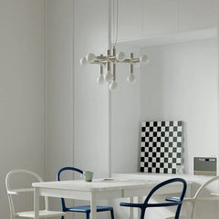 Modern silver 10-head space age pendant chandelier over white dining table, YH Lamps