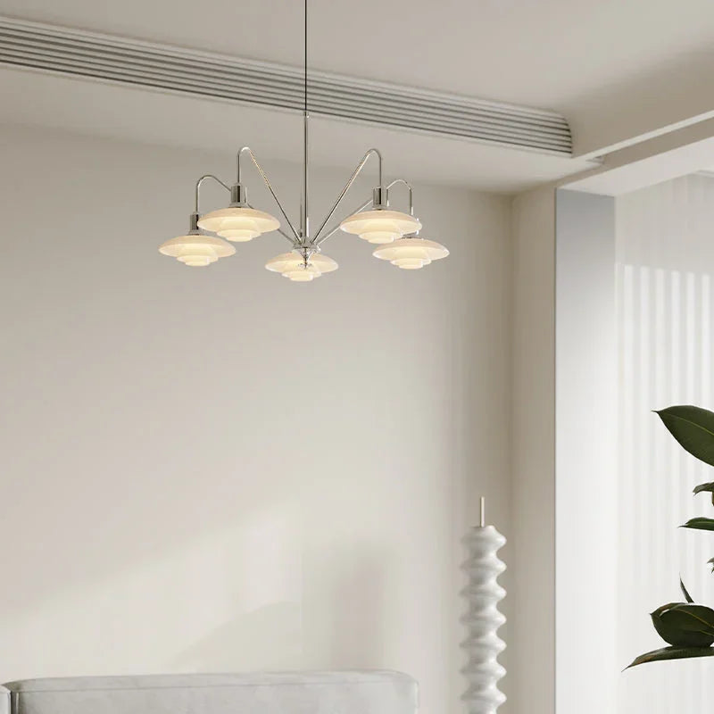 Modern silver chandelier with five lights in a minimalist living room, YH Lamps designer lighting.