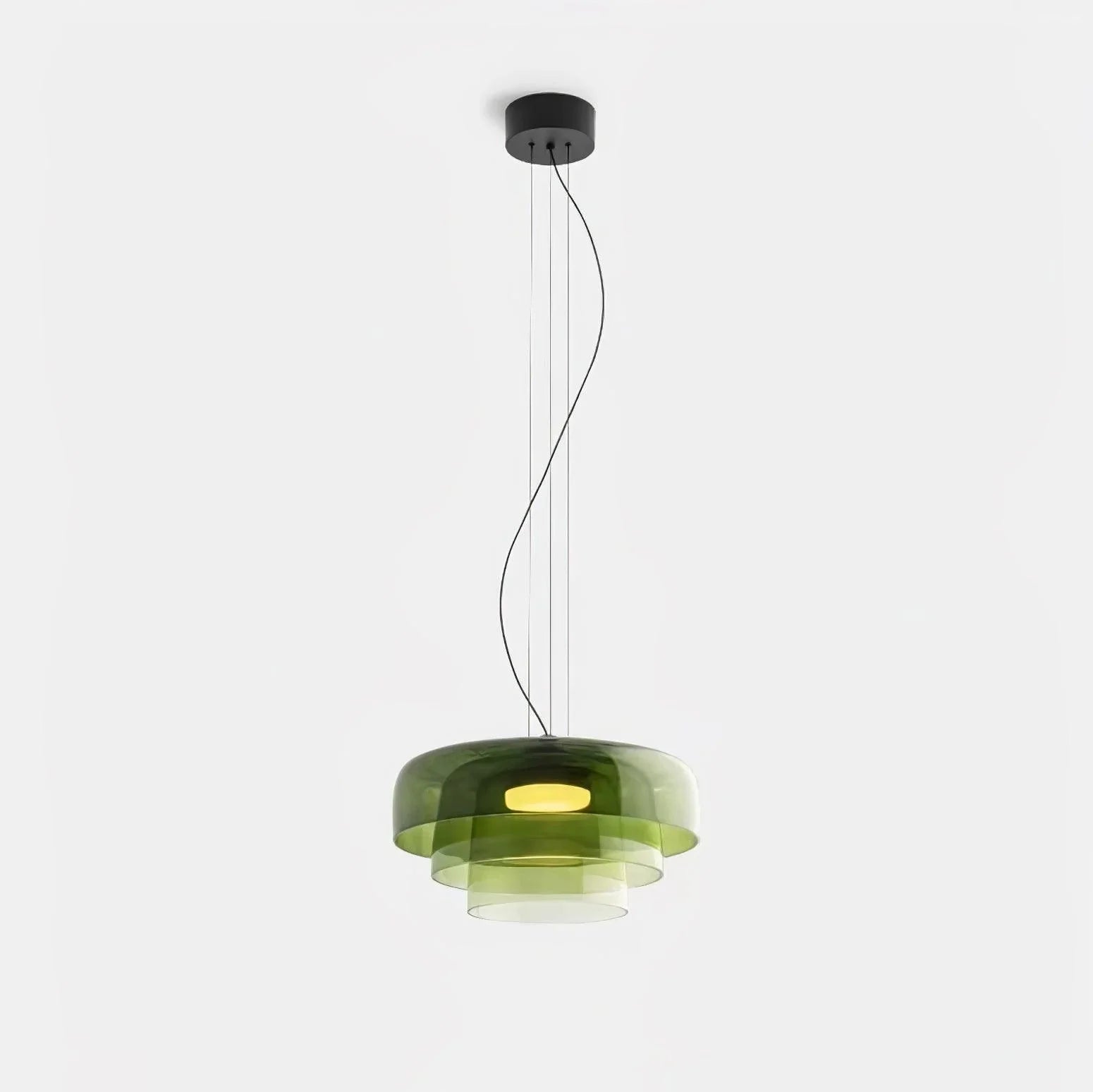Modern green glass pendant lamp with layered design and warm light, suspended by black cords