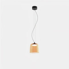 Modern single-layer pendant lamp with amber glass shade and warm light, suspended from black ceiling mount