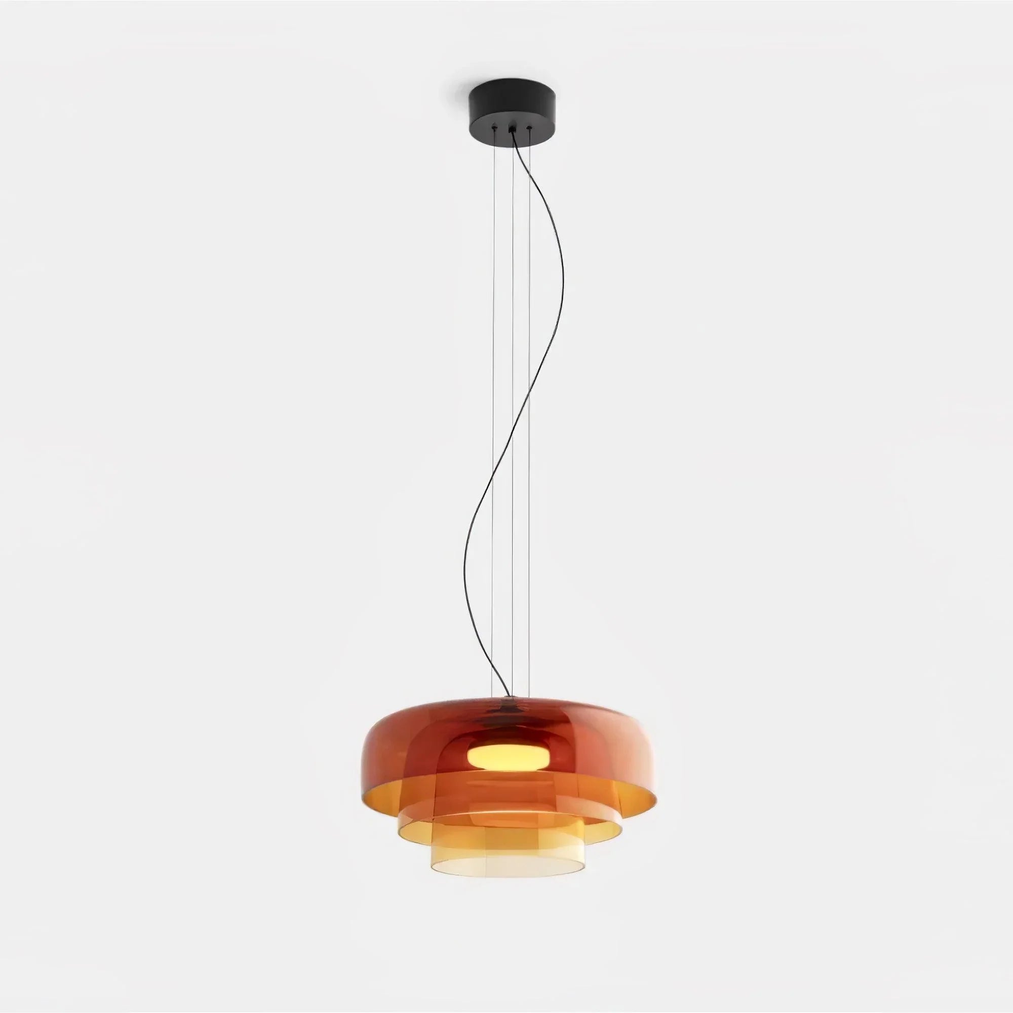 Modern pendant lamp with layered amber smoke grey glass shades and warm light, suspended from black ceiling mount