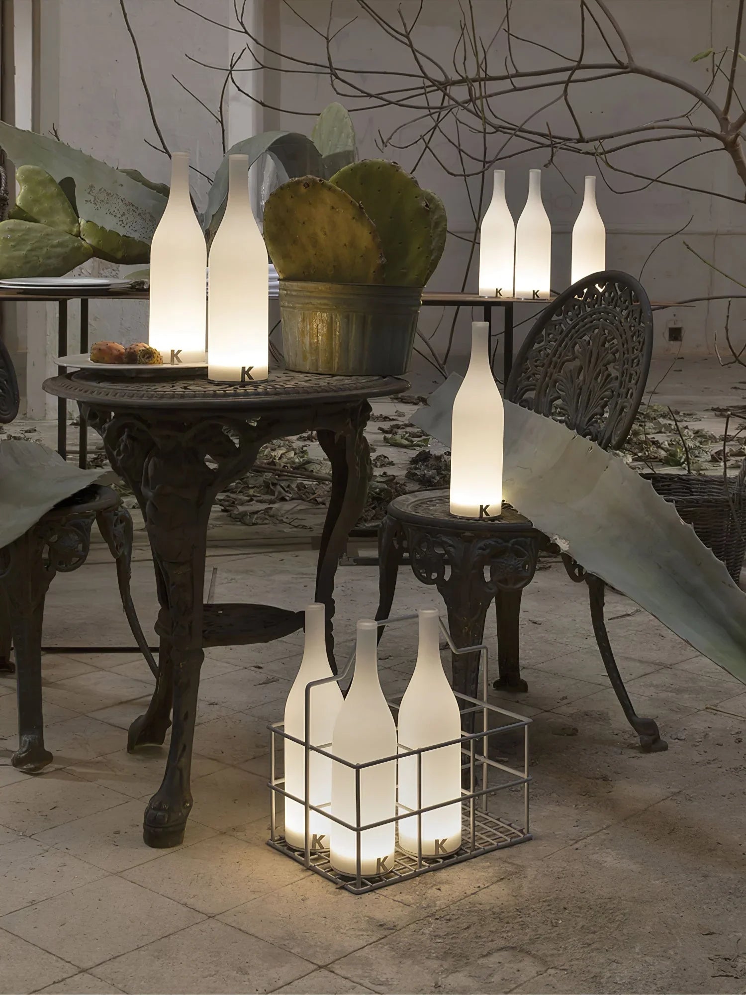 Modern table lamps shaped like frosted glass bottles on metal outdoor patio furniture, YH Lamps