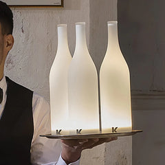 Modern white table lamps shaped like bottles on a tray, warm light, YH Lamps home lighting