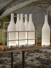 Modern white bottle-shaped table lamps with warm light and touch switch on a rustic table, YH Lamps