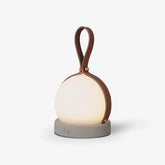 Modern round table lamp with brown handle, gray base, touch switch, warm white light