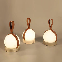 Modern YH Lamps table lamps with leather handles and built-in battery on neutral background