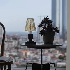 Modern black USB table lamp with ribbed glass shade on side table by window, YH Lamps style