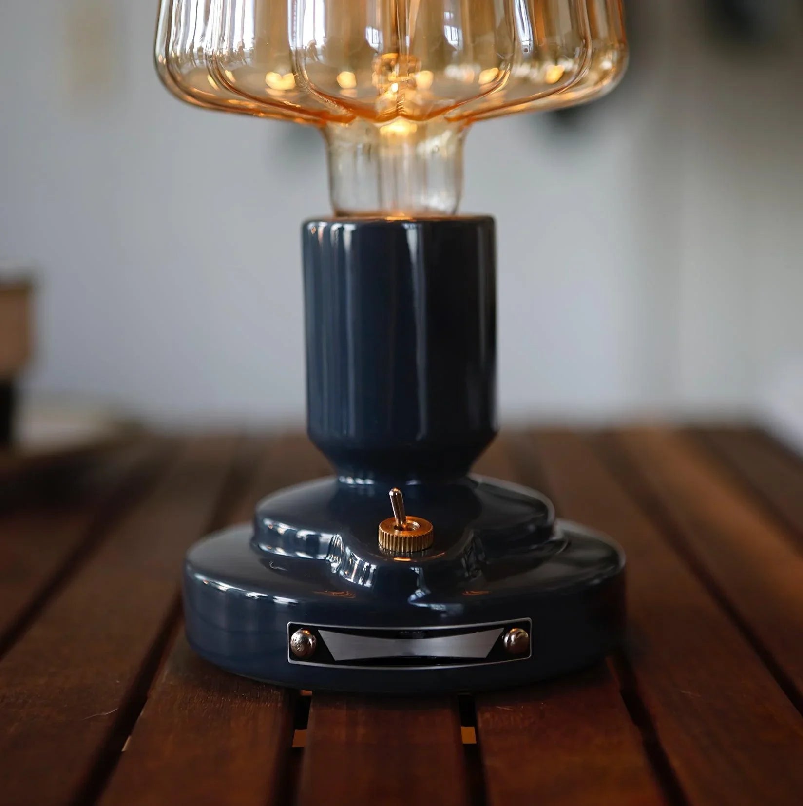 Modern black USB table lamp with amber glass shade on wooden surface, YH Lamps lighting