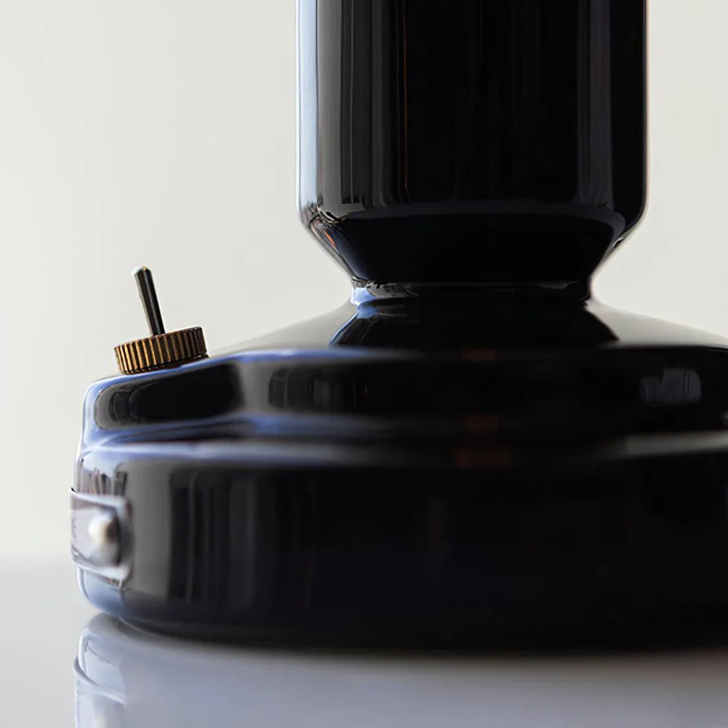 Close-up of black modern table lamp base with gold switch, YH Lamps home lighting design
