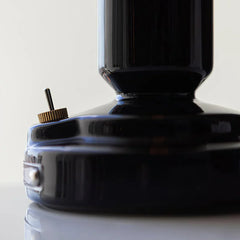 Close-up of black modern table lamp base with gold switch, YH Lamps home lighting design