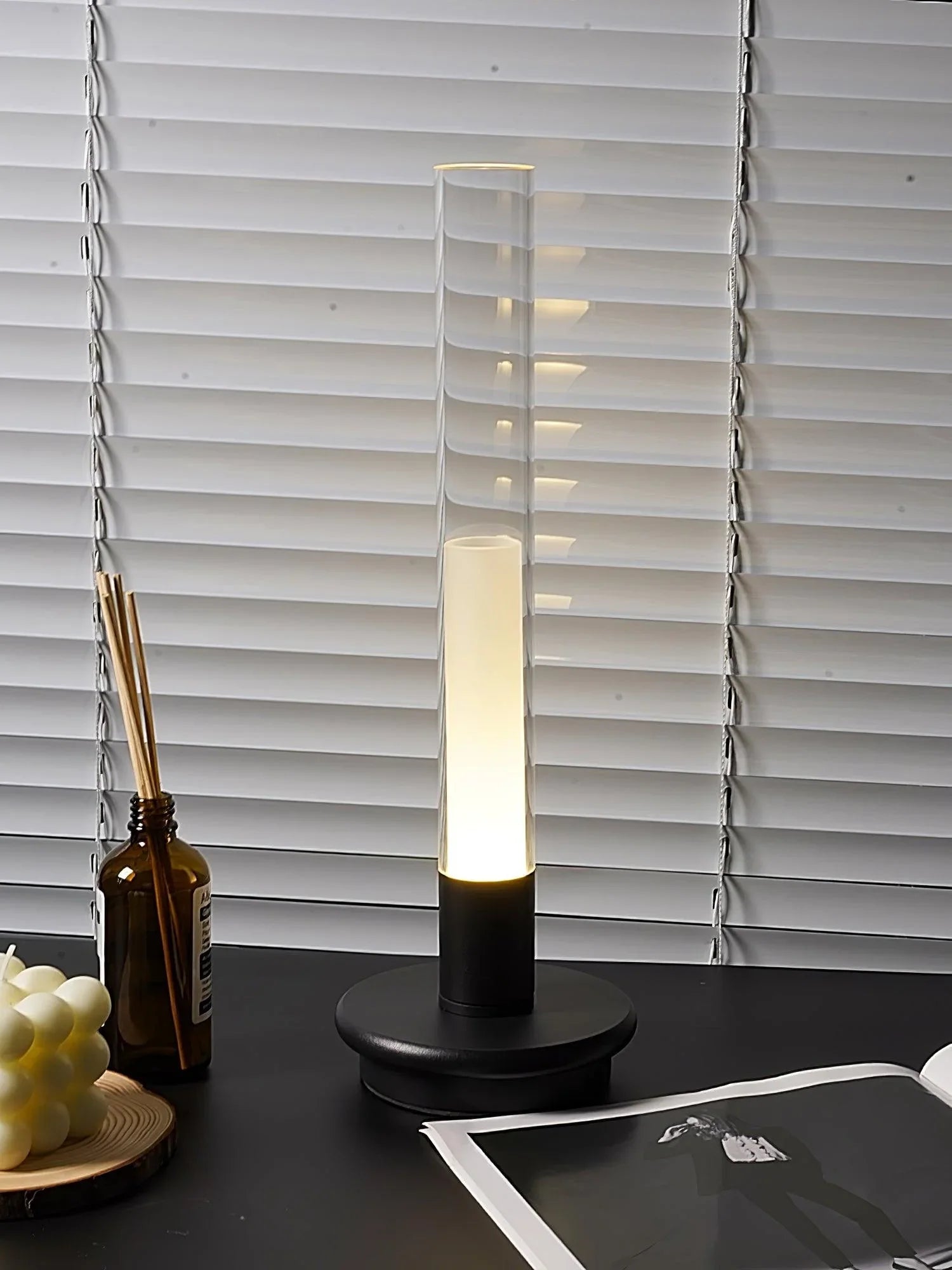 Modern black and clear column table lamp with warm light on desk, YH Lamps home lighting