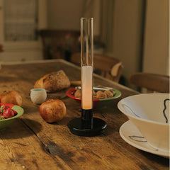 Modern black and clear column table lamp with warm light on rustic dining table, YH Lamps decor